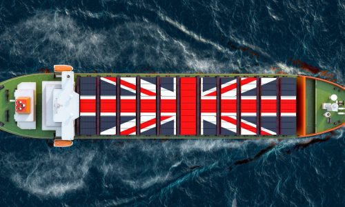 Freighter,Ship,With,British,Cargo,Containers,Sailing,In,Ocean,,3d